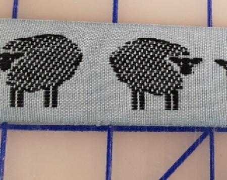 vevet bånd med sau motiv